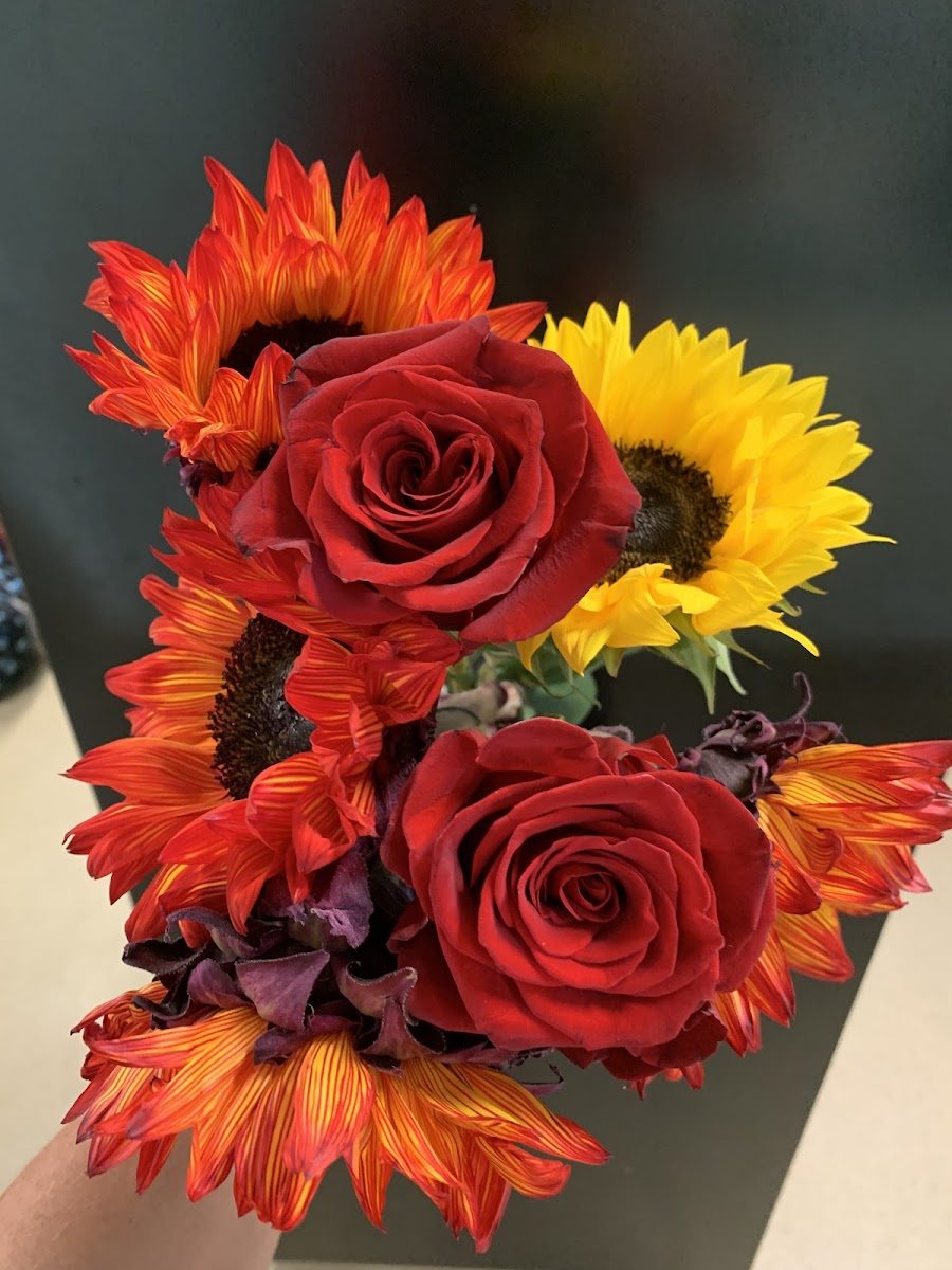 Red roses with sunflowers and orange lilies